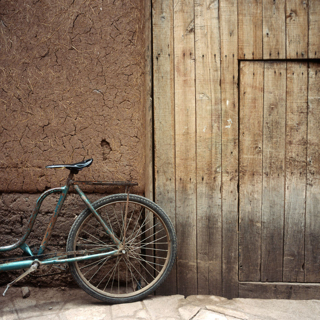 Bicycle leaning against a wall