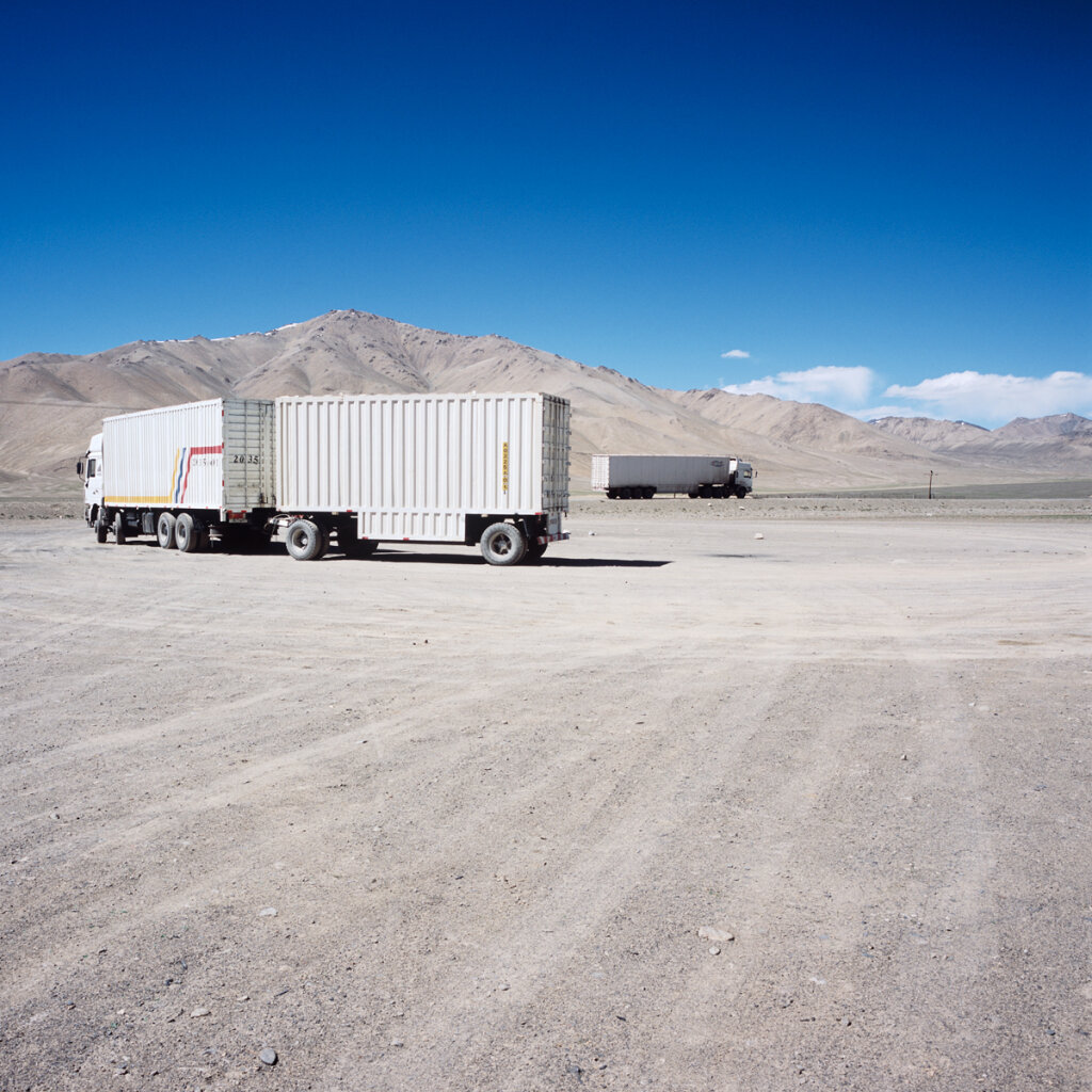 Chinese trucks taking the road after a lunch in Alichur